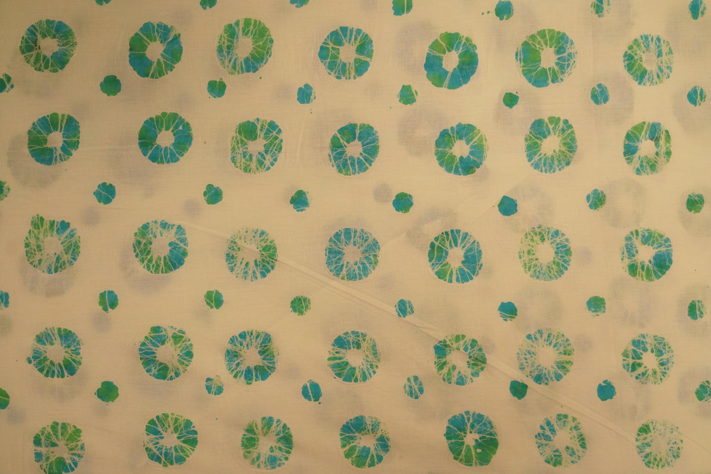 block cotton print - Mint white base with aqua blue & leaf green circular block prints.